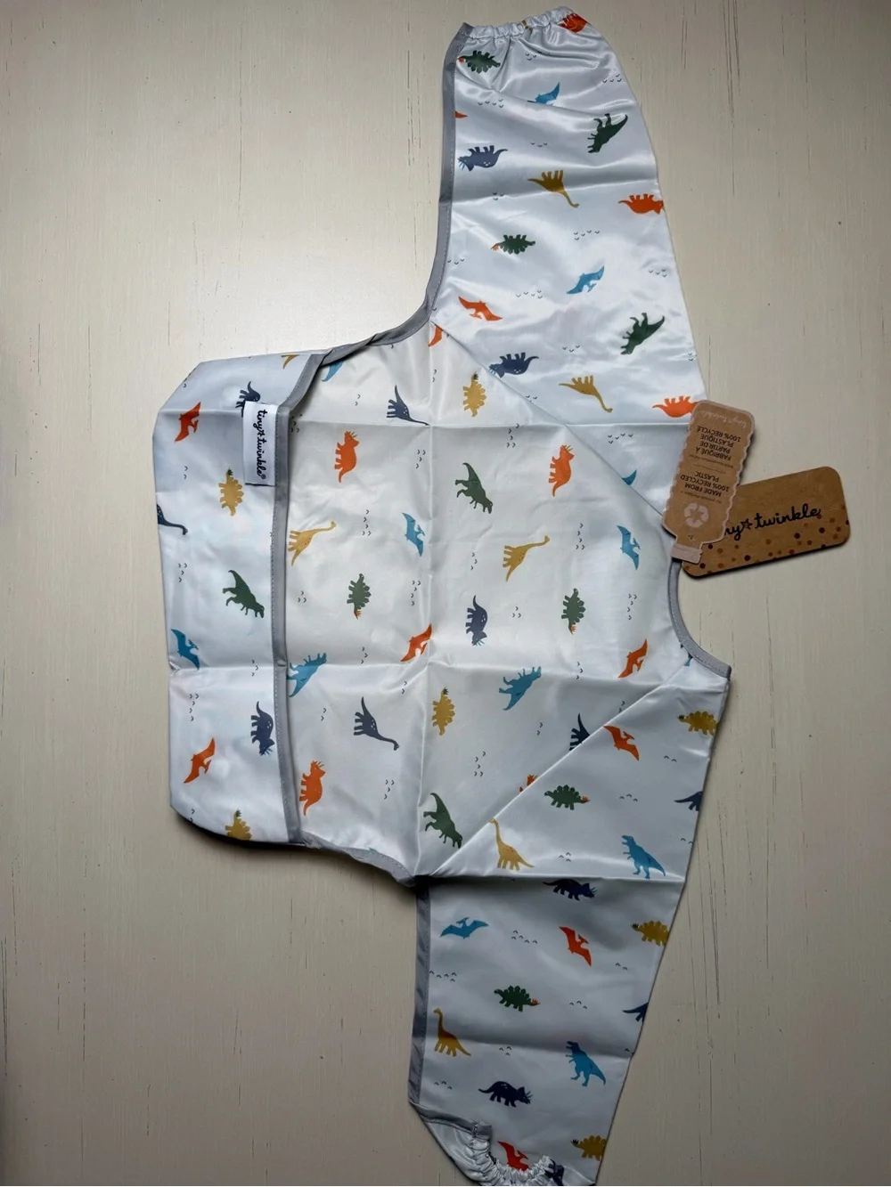 Tiny Twinkle Cream Long-Sleeve Dino Bib. Small.   A2